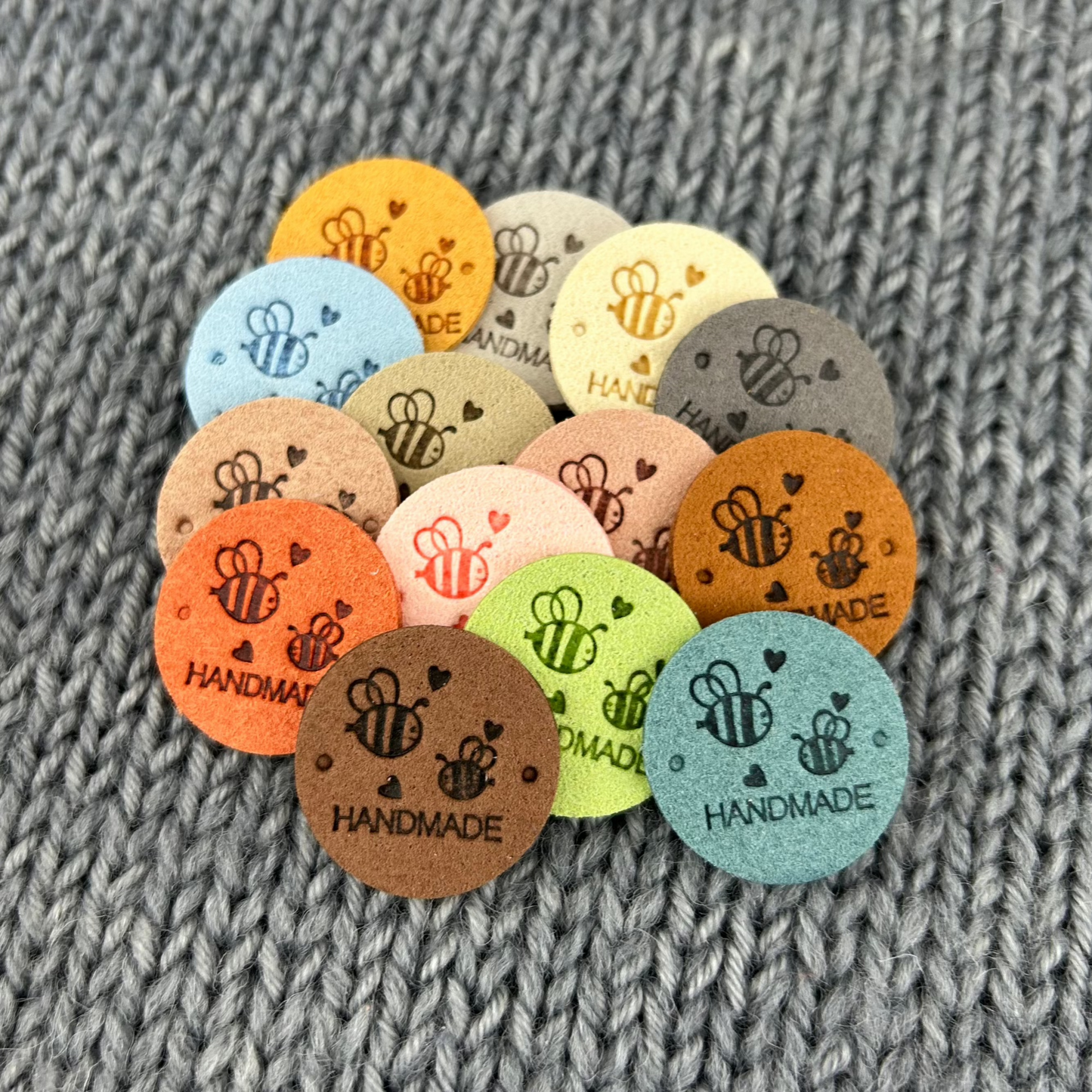 14 Round Bee Labels “Hand Made”, made from PU Pleather Faux Suede. Clothing Sew On Tags for Knitted, Crochet or Sewn Garments, Craft labels.