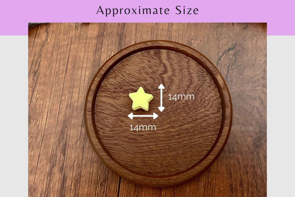 A small yellow star-shaped knitting needle stoppers shown on a round wooden board with overlaid dimension arrows and text reading 14mm, plus a purple header that says Approximate Size.