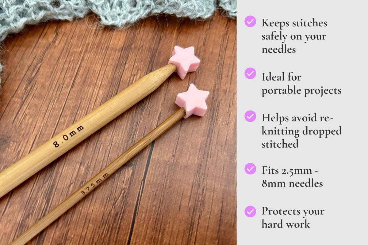 Two wooden knitting needles with pink star-shaped tips on a wooden surface next to a text panel describing benefits of the needle guard. Keeps stitches on needles. Ideal for portable projects. Helps avoid re-knitting dropped stitches. Fits mm to 2.5mm to 8mm needles 
