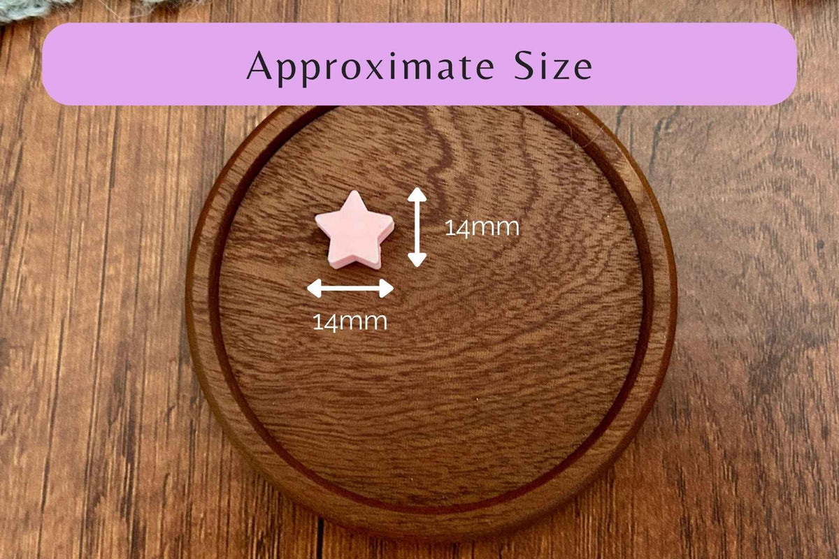 A pink star-shaped needle stopper shown on a round wooden board with overlaid arrows and text reading 14mm, plus a purple banner at the top that says Approximate Size, indicating dimensions.