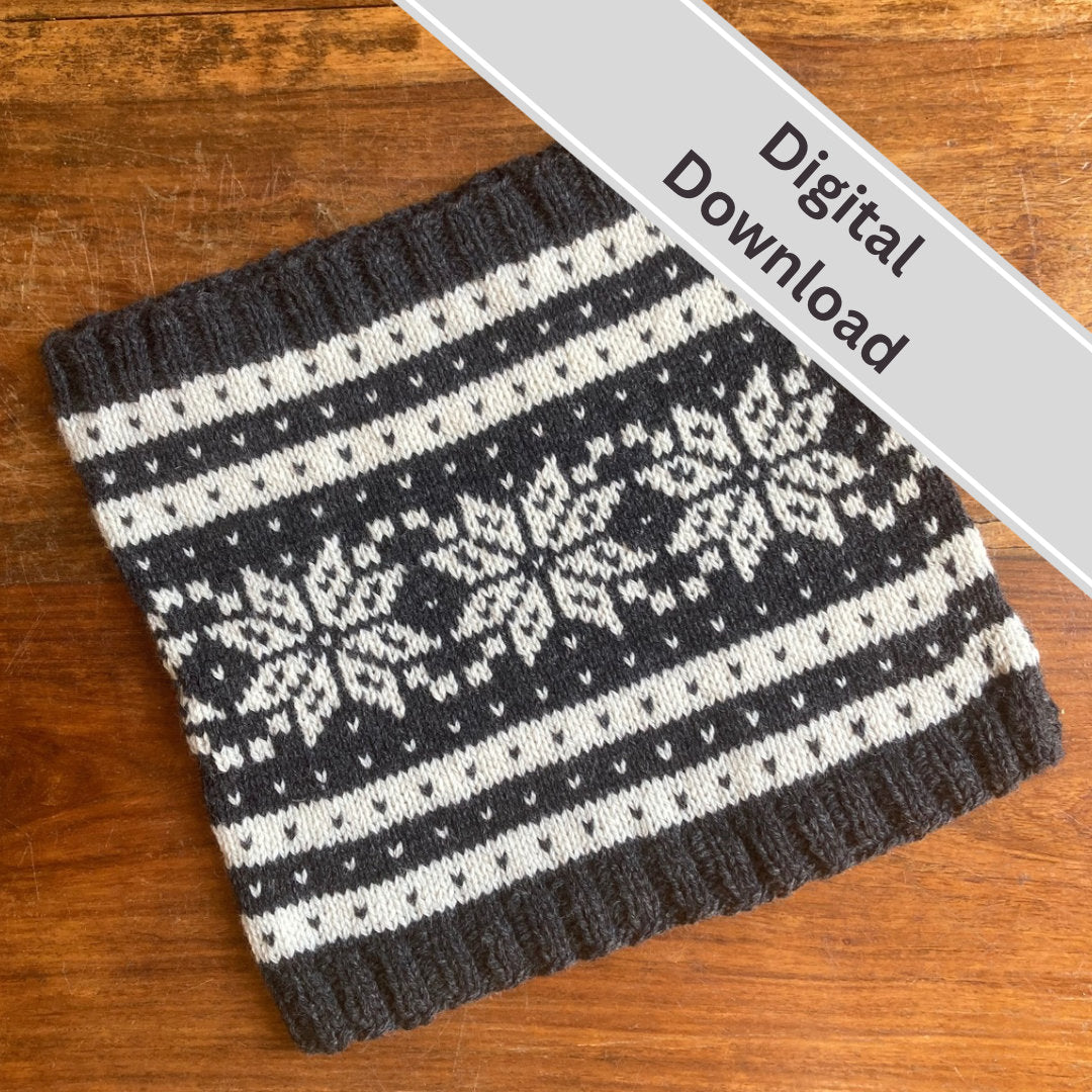 A knitted cowl with a dark gray and cream Nordic snowflake pattern, laid flat on a wooden surface with a diagonal 'Digital Download' banner overlay.