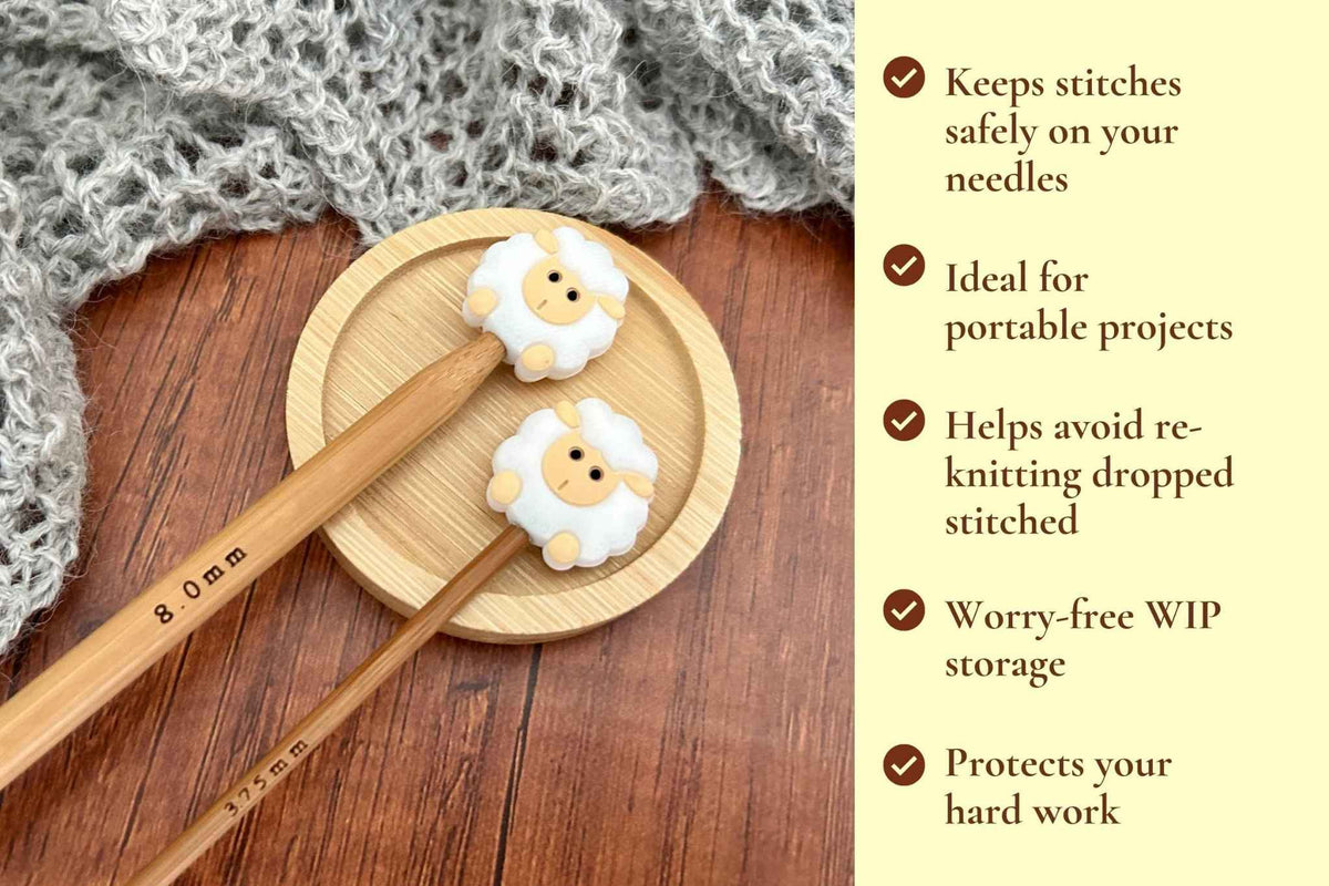 Wooden knitting needles with decorative sheep-shaped needle tips resting on a round wooden tray, with a gray knitted fabric in the background and a list of benefits on a pale yellow text panel at the right. Keeps stitches on needles. Ideal for portable projects. Helps avoid re-knitting dropped stitches. Fits mm to 2.5mm to 8mm needles 
